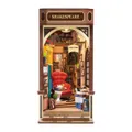 Book nook Librairie Shakespeare monté, enseigne et fauteuil rouge éclairés, sur fond blanc