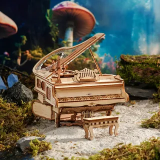 Petit piano en bois posé sur la mousse d'une forêt enchantée aux champignons géants