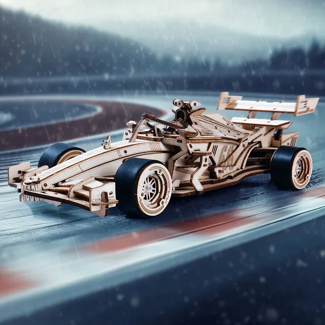 La monoplace lancée sur un circuit mouillé, décor de montagnes