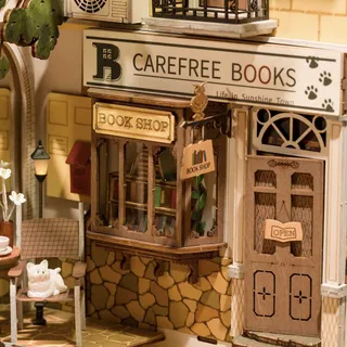 Détail de la librairie Carefree Books, de sa vitrine et d’un chat blanc