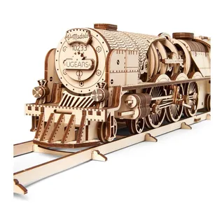 Avant d'une locomotive à vapeur en bois sur ses rails, chasse-pierres et roues motrices