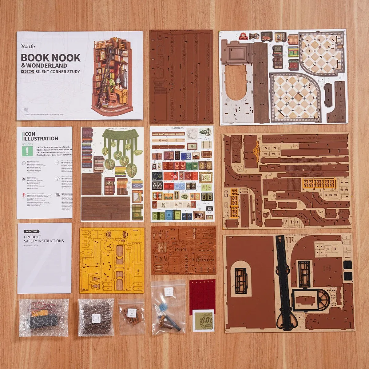 Le contenu de la boîte : planches imprimées, notice et sachets de petites pièces